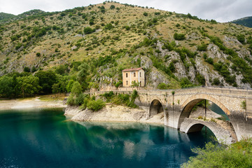 Fototapeta na wymiar Bridge over the Lake of San Domenico in the Gorges of Sagittarius
