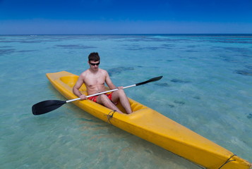 Maldives,  man in canoe