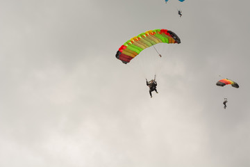 The parachutist flies. The paratrooper is in the air. Parachute flight.