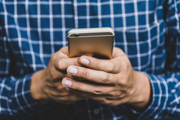 Close up Male hand using smartphone