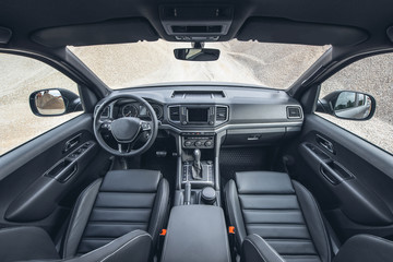 Beautiful view on canyon from modern suv saloon. Car interior with black leather and view on off...
