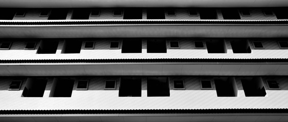 underside angle view of modern building skyscrapers roof - monochrome