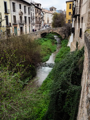 Fototapeta na wymiar Darro river, paseo de los tristes in Granada, Spain