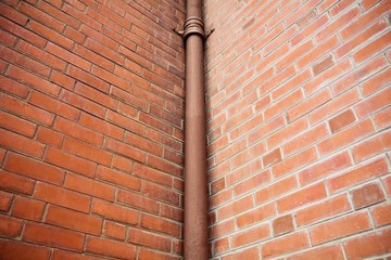 pipe at antique brick building
