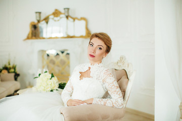 Obraz na płótnie Canvas Beautiful bride with stylish make-up in white dress