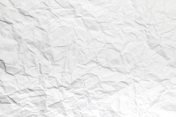 Background or pattern of Wrinkled white rectangular paper with rough texture.