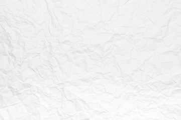 Background or pattern of Wrinkled white rectangular paper with rough texture.