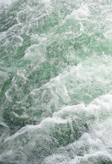 Rough stormy water in the river as a backdrop Wave or rapid curr