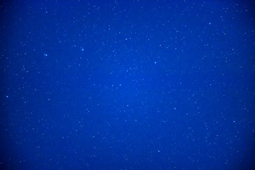 Night dark blue sky with bright stars as space background