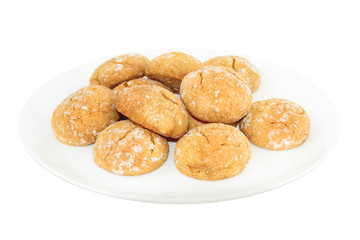 Sweet cookies on white plate at white background