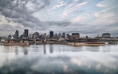 Montreal skyline reflected on the river on a cloudy morning