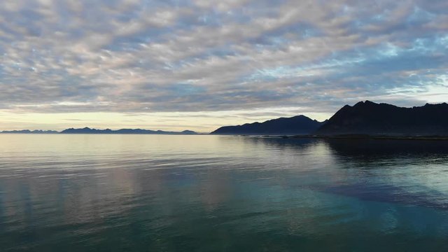 Coast of Gimsoya island, seascape in Gimsoysand in summer, midnight sun. Nordland county, Lofoten archipelago Norway. Tourist attraction.