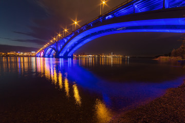 Reflection of the Communal Bridge in the Yenisei river, Krasnoyarsk, Russia. Urban landscape