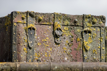 Sunken pirate treasure chest. Old trunk recovered from the sea. Ancient travel suitcase.