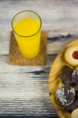 Orange juice and different types of cookies