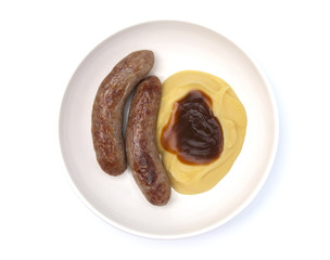 Bangers and Mash or Sausage and Mashed Potatoes in a White Plate