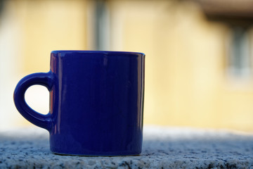 Cup of tea or coffee on defocused background