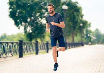 Happy man during morning jogging, outdoors