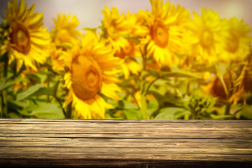 beautiful sunflowers and an old wooden table  