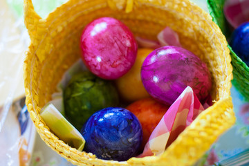 Colorful easter eggs in basket