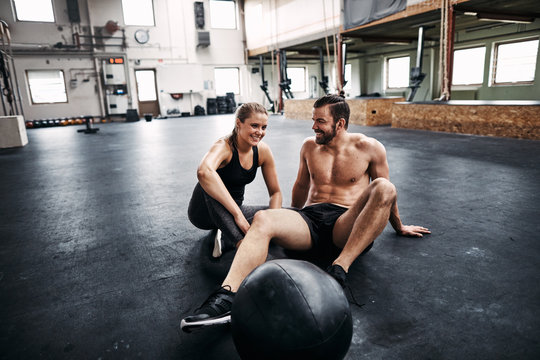 Fit young couple taking a break from working out together
