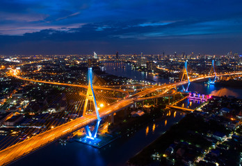 Bangkok Expressway top view, Top view over the highway,expressway and motorway at night, Aerial view interchange of a city, Shot from drone, Expressway is an important infrastructure in Thailand