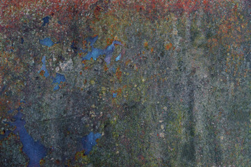 The old iron with rubbed paint and stains of rust. Iron background.
