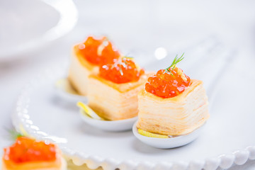 Tartlets with red caviar