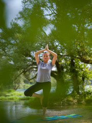 Fototapeta na wymiar woman meditating and doing yoga exercise