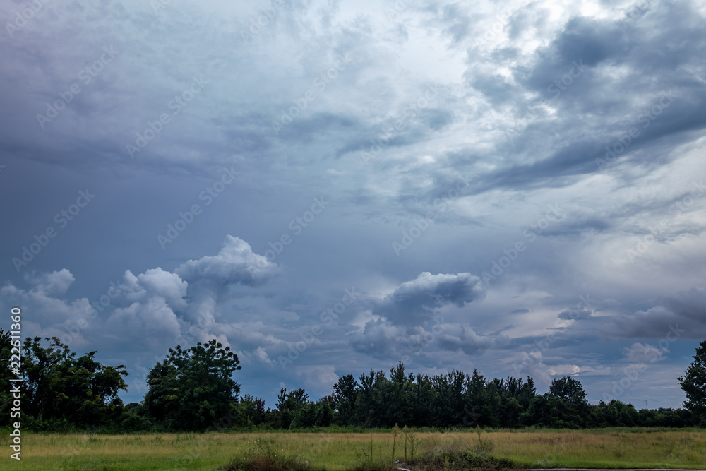 Wall mural landscape with blue sky and clouds