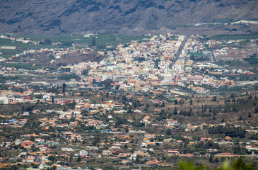 Fototapeta na wymiar Panoramic view on the city Los Llanos in the valley. Banana plantations and mountains in the background.