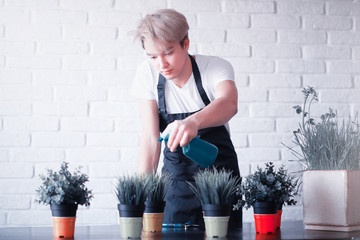 Young Asian boy takes care of plants