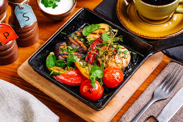 Fototapeta na wymiar grilled vegetables in a pan grill closeup.