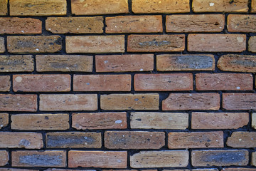 Fototapeta premium Vintage cleaned red brick wall. Empty background of horizontal brickwork.