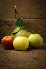 bergamot orange . apple. guava. shinese pear. on old wood