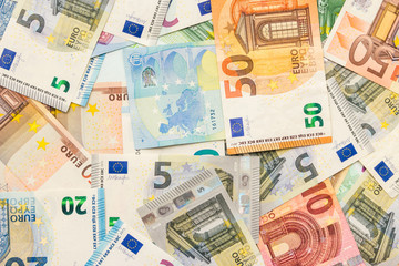 Background from euro banknotes of different denominations. The concept of wealth and luxury