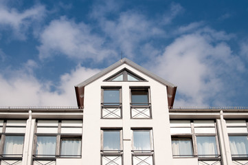 Apartment building with a peak roof
