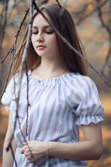 Young girl on a walk in the autumn 