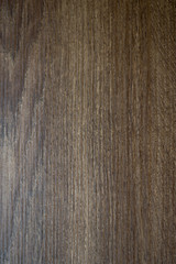 Fototapeta premium Texture of brown wooden board for furniture. Dark background. 