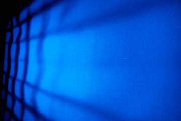 Blue background with black grille