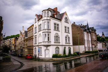 Fototapeta na wymiar old stone buildings in the rain