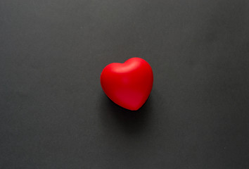 Close up red heart symbol of love isolated on white backgroound.  Hand holds red heart. St. Valentines day. Objecr photography. Health and cardiovascular risk of diseases. Cardiology news. 