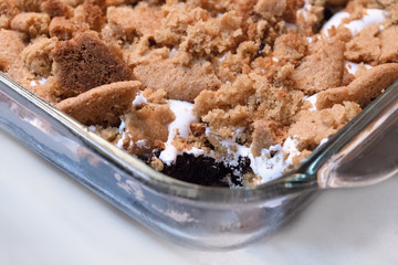 Gluten free brownie cookie crumble in glass bakeware