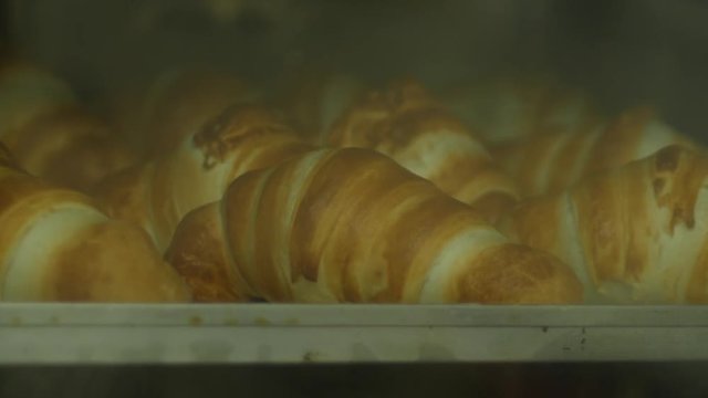 Time lapse traditional french croissants baking in oven
