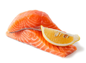 Raw salmon fillets with lemon, isolated on white background.