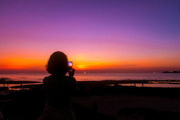 silhouette of woman at sunset