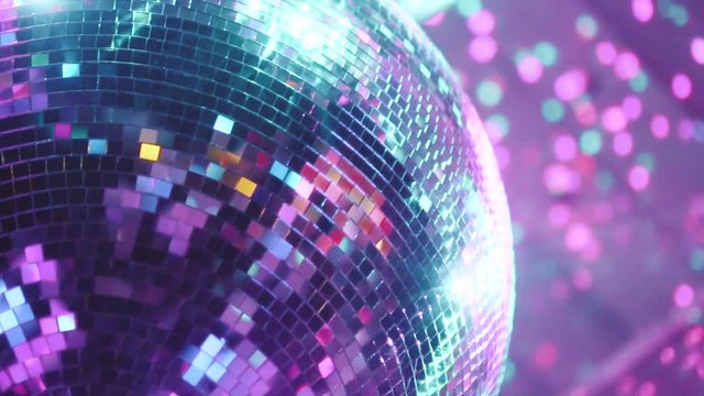 Beautiful mirror balls rotates under the ceiling. Night disco party concept