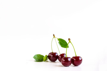 ripe cherries on a white background