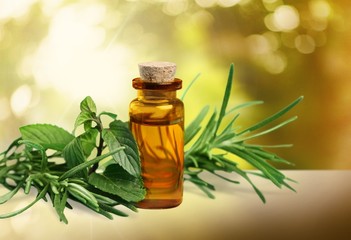 Essential Oil with Rosemary Sprig Isolated