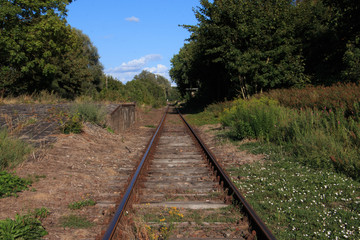 Obraz premium single train track on lost places trainstation